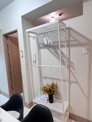 a room with a shelf with a plant in it at UNISTAY Shore 3 Tower 2 Pool Vw w Bal in Manila