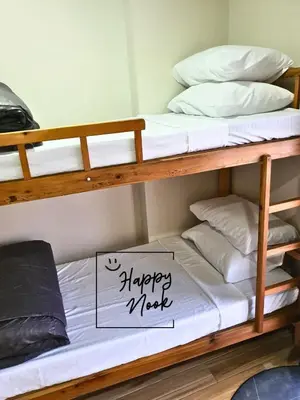 a couple of bunk beds with a happy meet sign on them at Happy Nook at Holland Park Condominium in Biñan
