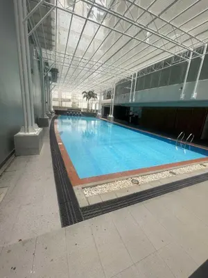 a large swimming pool in a large building at Antel Spa Residences 2505 in Manila