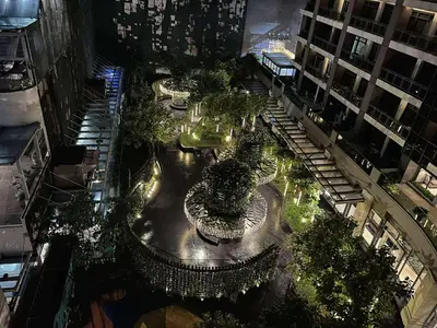 an overhead view of a city street at night at Gramercy Makati Condotel in Manila