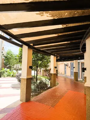 a building with awning over a brick walk way at JFam Suites, C4-10R Studio, Up To 4 Pax in Biñan