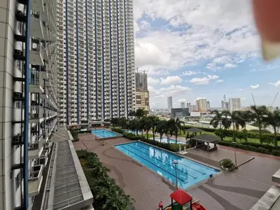 a view of a swimming pool from a building at Studio Units at SM Light Residences Condo Beside Boni MRT Station in Manila