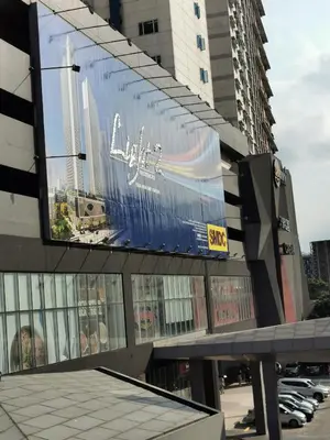 a large billboard on the side of a building at Studio Units at SM Light Residences Condo Beside Boni MRT Station in Manila