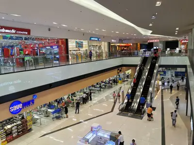 a group of people walking around a shopping mall at Studio Units at SM Light Residences Condo Beside Boni MRT Station in Manila