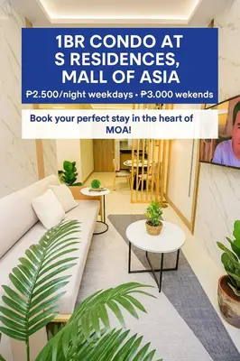 a living room with a couch and a table at Stylish & Cozy 1 bedroom near Mall of Asia in Manila