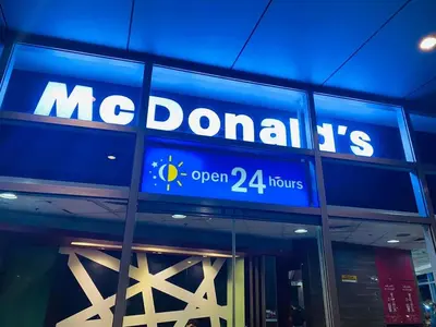 a sign on the side of a mcdonalds restaurant at Morgan Suite a6 BGC shortwalk Venice Canal Mall in Manila