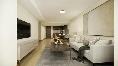 a living room with a white couch and a table at Savea Bay City Manila in Manila