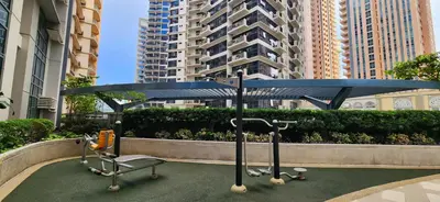 a table with two exercise equipment in a city at 14e BGC Unit 3 mins Walk to The Venice Grand Canal Mall Pet Friendly in Manila