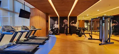 a gym with treadmills and cardio equipment in a building at 11a Spacious Suite with Resort Amenities Free Parking with Washer Great for Long Stays in Manila