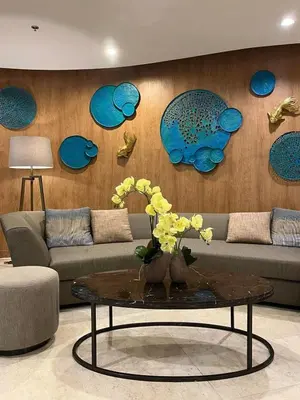 a living room with a couch and a table at Affordable Stay in MOA in Manila