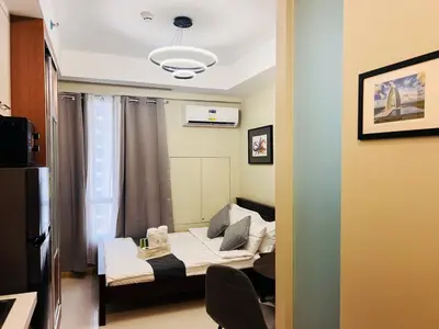 a small room with a bed and a window at 1BR Condotel Suite at Sunshine100 City Plaza #SS05-1 in Manila