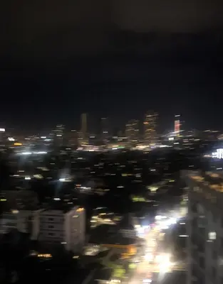 a view of a city at night with lights at Jhen in the City in Manila