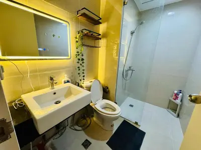 a bathroom with a sink and a toilet and a shower at Venice IG-Worthy , Netlfix Getaway walking distance to Mall in Manila