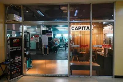 an entrance to a restaurant with the door open at Cedrosa Lofts GA Tower in Manila