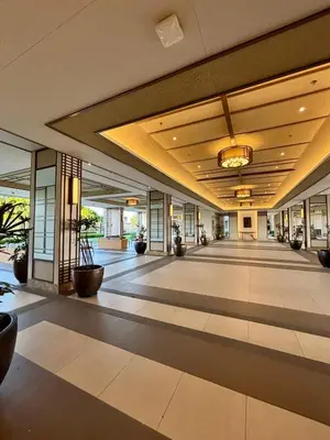 an empty lobby of a building with plants on the floor at Metro Zen at DMCI Satori Residence 1br in Manila