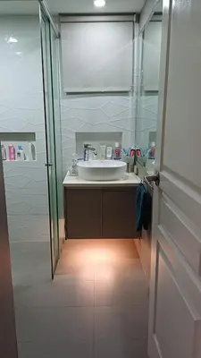 a bathroom with a sink and a glass shower at 2 BR, 2 Full Bathrooms, with hotel feels and a jet tub in Manila