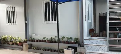 a group of potted plants sitting on a wall at 6 Guest - Unit 4 Studio Type - Container house in Santa Rosa