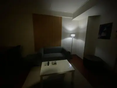 a living room with a couch and a table at BGC condo for rent in taguig in Manila