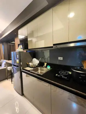 a kitchen with a sink and a counter top at Cozy and Luxurious Condominium in Manila