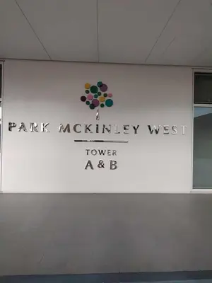 a white wall with a park mystery west tower sign at Condo Suite 1 Bedroom McKinley West Taguig City in Manila