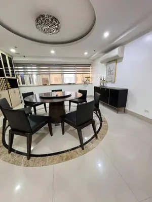 a dining room with a table and chairs at R&R Entire Rental Unit in Manila