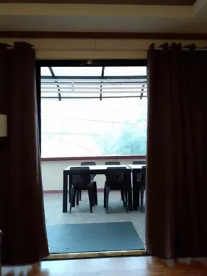 a table and chairs in a room with a window at CasaCavite - Your Chill Hideaway and Mini-Resort Just Minutes from all the Tagaytay-Silang-Nuvali Action! in Silang