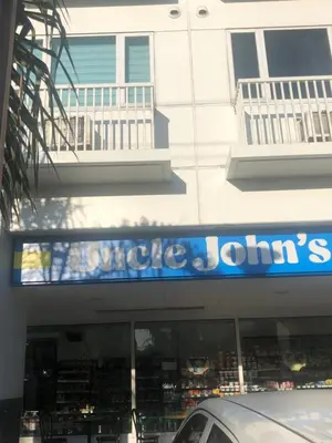 a store with a blue sign on the side of a building at SM MOA staycation condotel in Manila