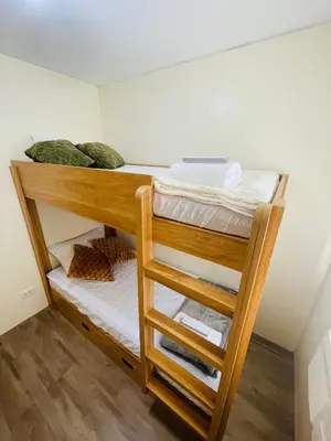a couple of bunk beds in a room at E&L Family Suite in Manila