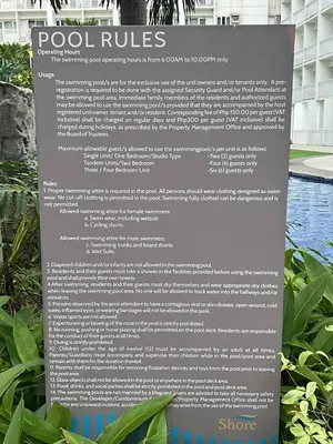 a sign for a swimming pool at a resort at Gracie's Suites by Staycation With FREE Parking in Manila