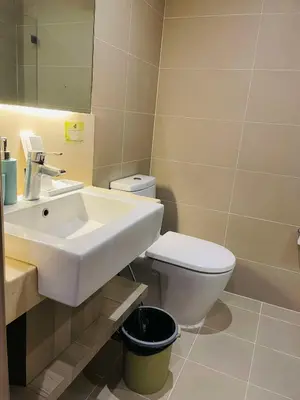 a bathroom with a sink and a toilet at Folks Hub in Manila
