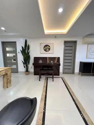 a living room with a pool table and a piano at R&R Empire Rental Unit in Manila