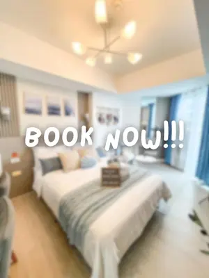 a bedroom with a bed with the words book now at Room at SM Bicutan GJ in Manila