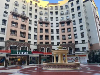 a fountain in front of a large building at Spacious 2 Bed & 2 Bath Condo in Newport City in Manila