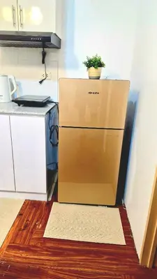 a box with a plant on top of it in a kitchen at 1BR with Netflix, Prime & KTV in Manila