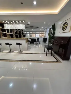 a lobby with a piano and a table and chairs at R&R Entire Rental Unit in Manila