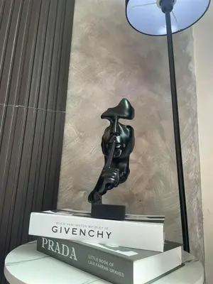 a statue sitting on top of a book at SM Bicutan Staycation Bahamas in Manila
