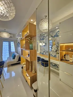 a kitchen and living room with glass walls at Luxury Condotel Manila by MOA in Manila