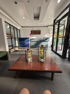 a table with flowers on it in a building at The Seaside Residences in Manila
