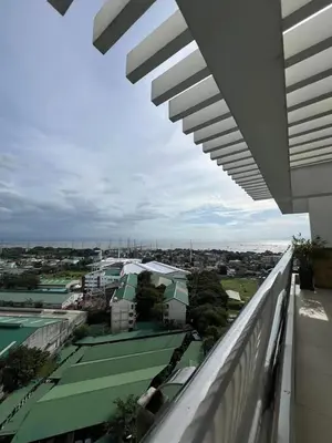 a view of a city from the balcony of a building at Peaceful Getaway in Manila