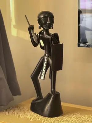 a bronze statue of a woman holding a gun at Azure Urban Resort paranaque in Manila