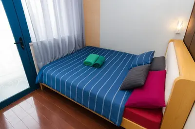 a bed with two pillows on it in a room at Velvet Vibe Chic Makati Stay Pool Gym 4034 in Manila