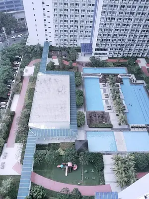 an overhead view of a building with two swimming pools at Maria's staycation in Manila