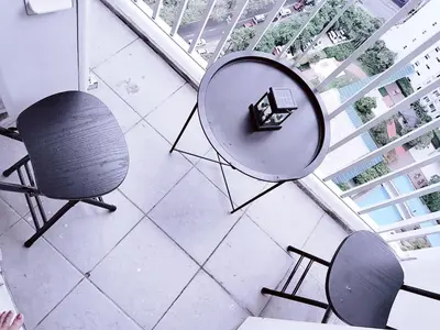 an overhead view of a table and chairs in a room at Maria's staycation in Manila