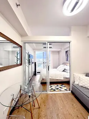 a room with a glass table and a bed at Skyline Hideout in Sampong