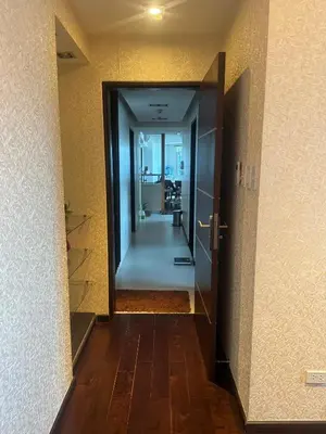 a hallway with an open door leading to a room at 4 Bedroom Luxury Condo in Ortigas in Manila