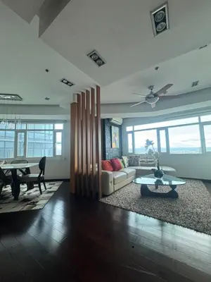 a living room with a couch and a table at 4 Bedroom Luxury Condo in Ortigas in Manila
