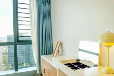 a room with a desk and a large window at Premium 2 Bedroom and 1 Living Room Suite with Balcony - One Uptown, BGC in Manila