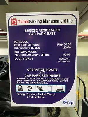 a sign for a car parking management line at Casa Orana in Manila