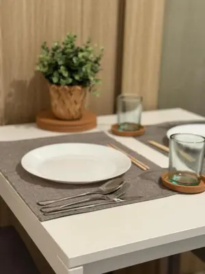 a table with a plate and a potted plant on it at Near NAIA AIRPORT in Manila