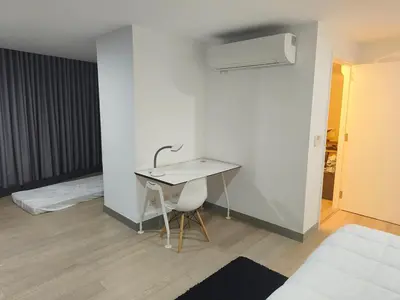 a desk and a chair in a room at In the City in Manila